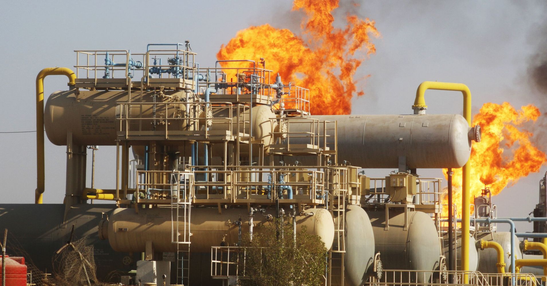 Flames emerge from a pipeline at the oil fields in Basra, southeast of Baghdad, Iraq, October 14, 2016.