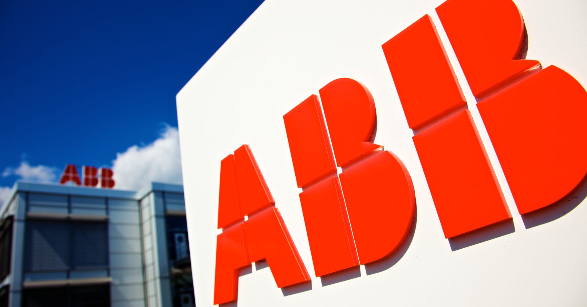 Logos of ABB AG sit on display outside the company's semi-conductor plant in Lenzburg, Switzerland.