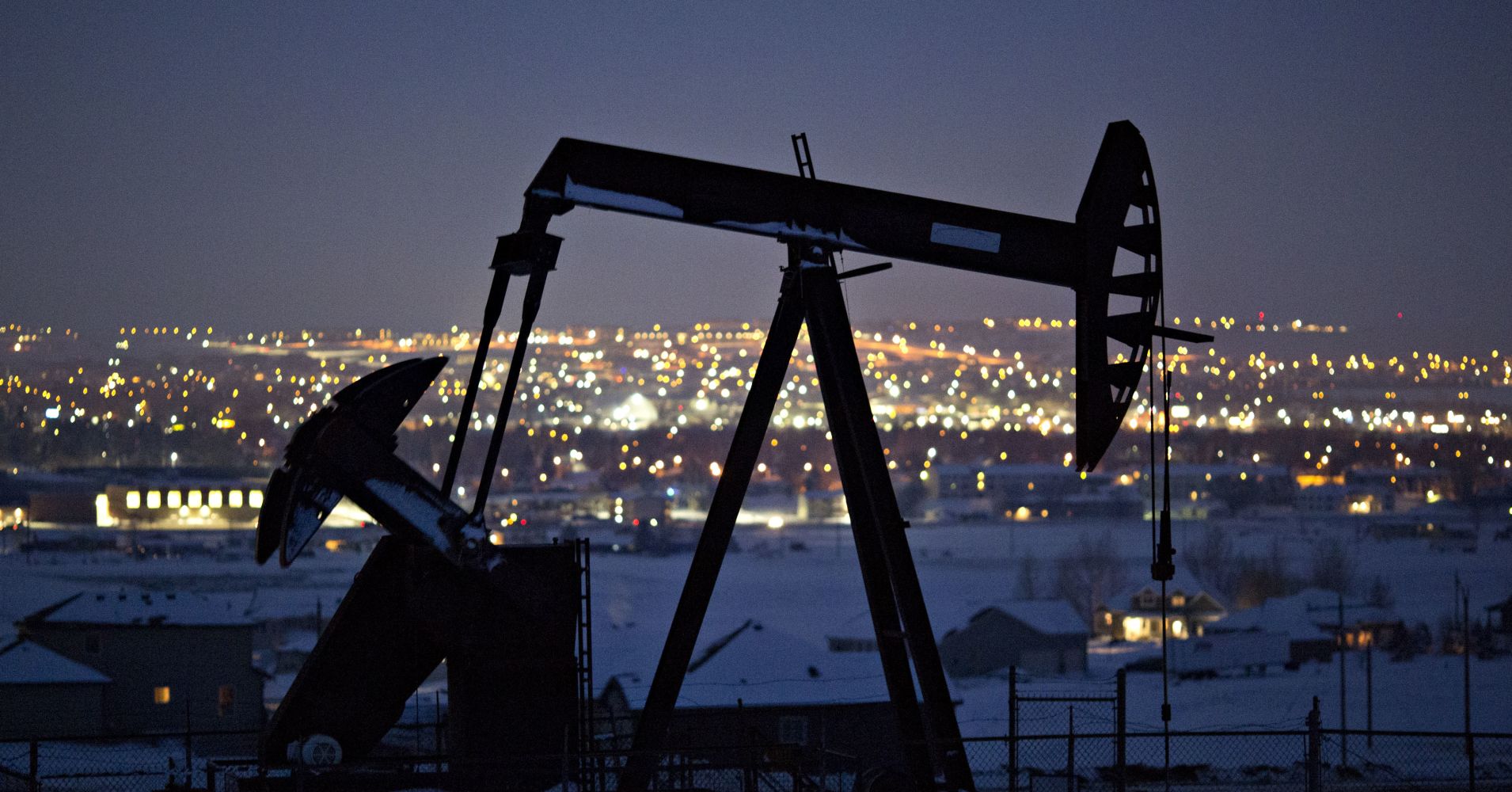 A pumpjack operates above an oil well at night in the Bakken Formation on the outskirts of Williston, North Dakota, U.S., on Thursday, March 8, 2018. 