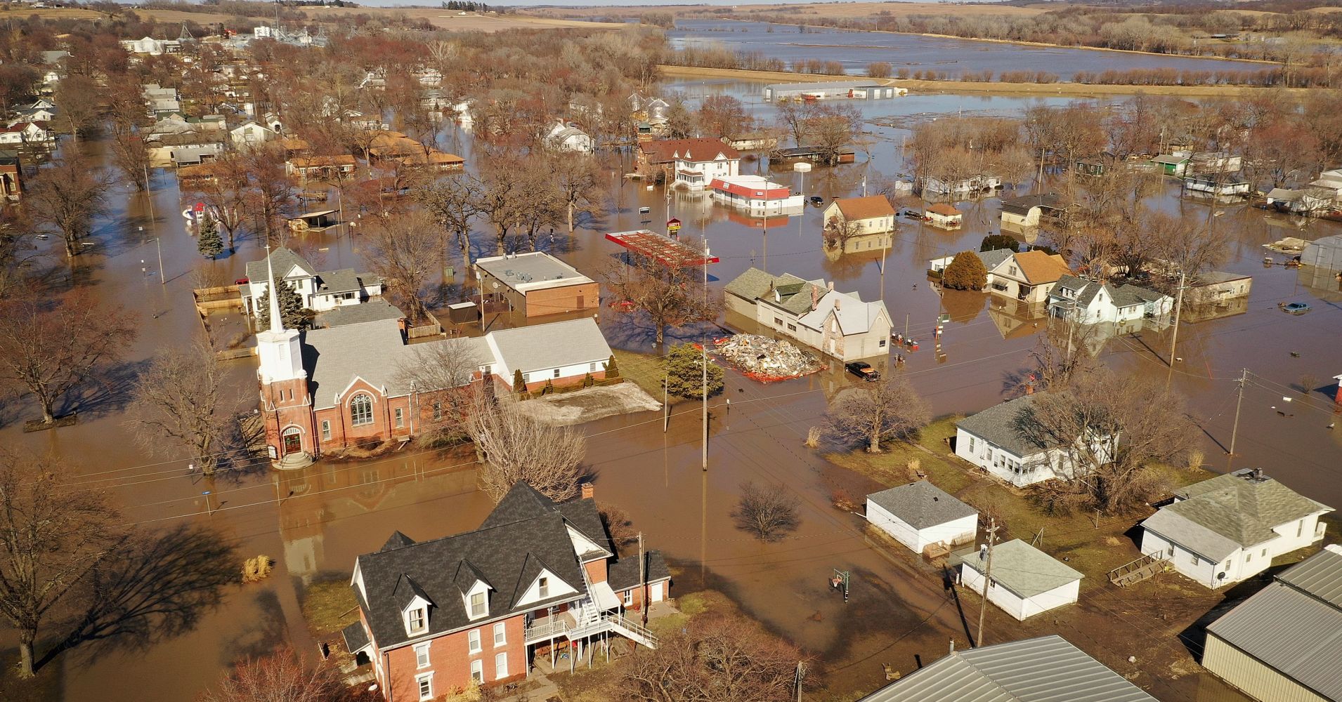 Homes and businesses are surrounded by floodwater on March 20, 2019 in Hamburg, Iowa.