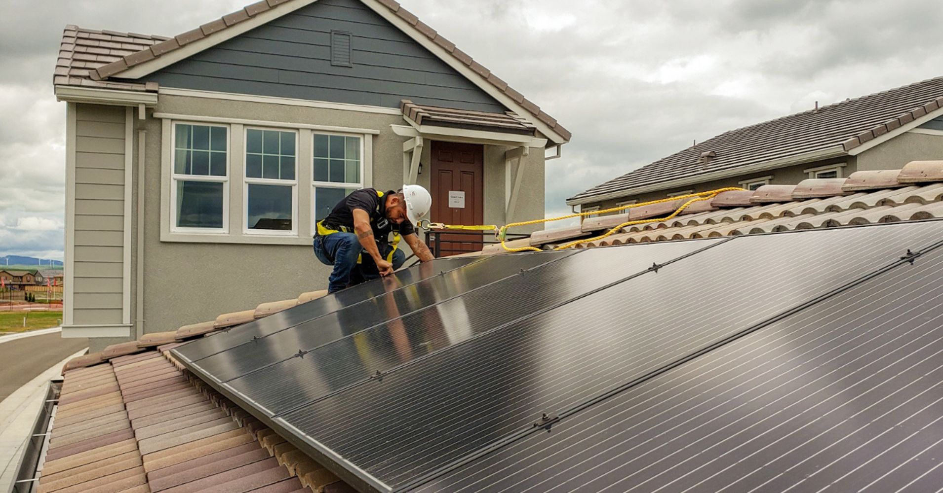 PetersenDean says it will need some 400 additional solar installers like Ruben Trujillo by year's end, due to a new California mandate.