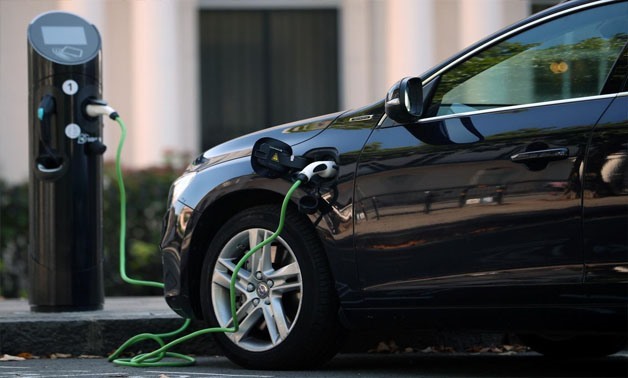 A Volvo hybrid car is seen connected to a charging point in London, Britain September 1, 2017. REUTERS/Hannah