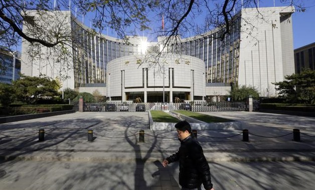 China's central bank says to keep yuan stable, in balanced range