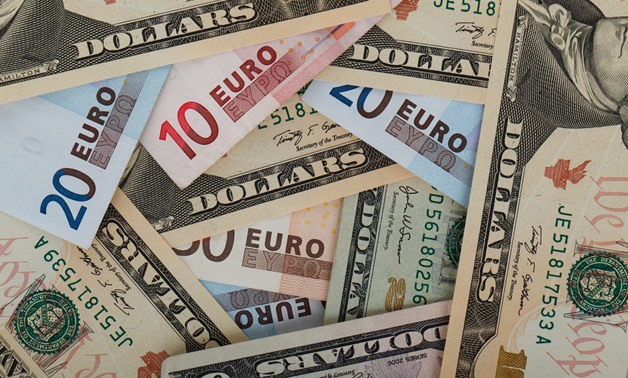 FILE – Dollars and Euros – public domain pictures/Petr Kratochvil